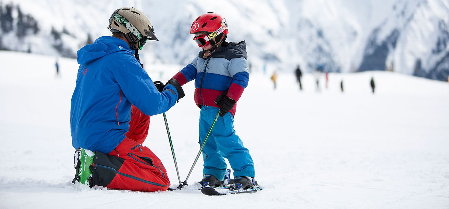 father and son on skis